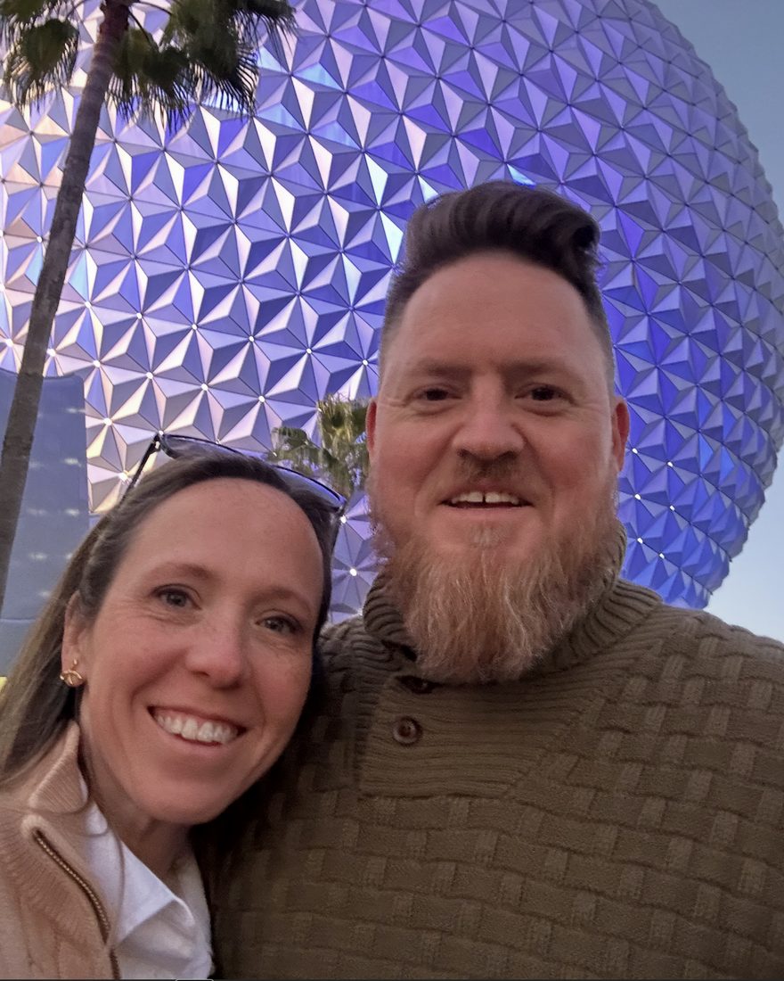 Lynne Mashburn at EPCOT, in front of Spaceship Earth
